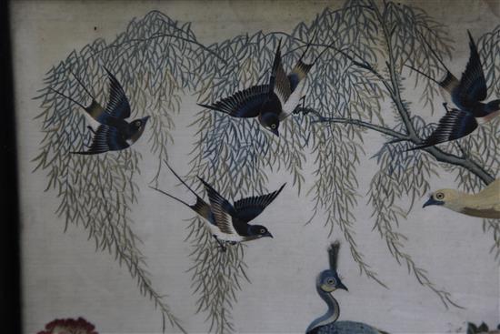 A Chinese embroidered silk picture of birds amid rockwork and foliage, late 19th / early 20th century, 56 x 63cm, losses to frame